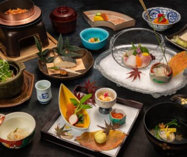 Assorted Japanese small dishes and sashimi on lacquer trays at ABBA Resorts Izu in Shizuoka