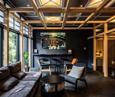 Modern lounge with wooden beams, sofas and large windows at AWA Nishi-Izu, Shizuoka