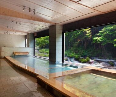 Spacious indoor wooden onsen baths with garden view at Shosuke no Yado, Aizu, Fukushima