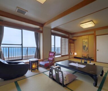 Tatami room with low table, shoji screens and balcony sea view at Ako Onsen Shiosaikirara Shokichi Hyōgo