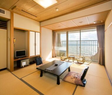 Tatami room with low table and cushions at Ako Onsen Shiosaikirara Shokichi, Hyōgo, Japan