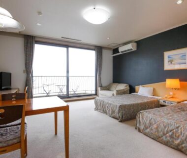 Western-style twin room with desk and balcony at Amanohashidateso in Kyoto