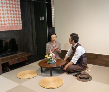 Two guests seated around a low table in a tatami room at Andon Ryokan Tokyo