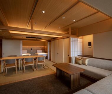 Spacious Japanese-style living and dining area with tatami, low table and sofa at Arima Grand Hotel, Hyōgo