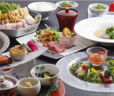 Assorted Japanese dishes with small bowls and soups for ryokan dining at Arima Hot Spring Ryokan Hanamusubi, Hyōgo
