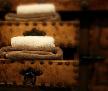 Stacked towels on ornate wooden chest at Arima Onsen Tocen Goshobo in Hyōgo, Japan
