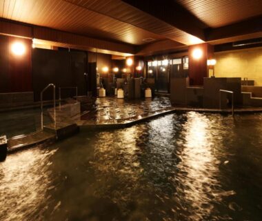Warm indoor onsen bath with wooden ceiling and soft lighting at Arima Royal Hotel, Hyōgo