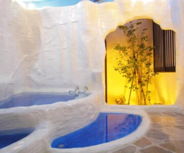 White cave-style baths with illuminated bamboo alcove at Arimakan, Yamagata