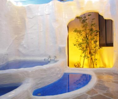 White cave-style baths with illuminated bamboo alcove at Arimakan, Yamagata