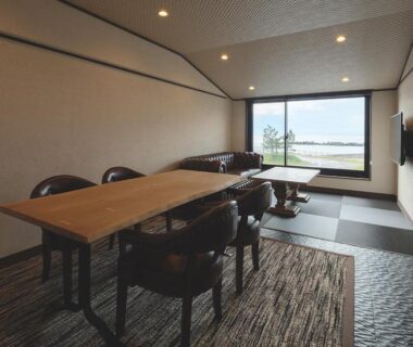 Tatami seating, low table and large window with water view at Arujisu, Shizuoka, Chūbu Japan