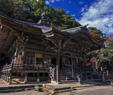 Carved wooden shrine with forested backdrop near Asagiriso in Hyōgo