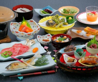 Assorted traditional Japanese dishes on lacquer table at Ashinomaki Prince Hotel, Fukushima, Tōhoku
