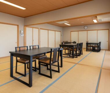 Spacious tatami dining area with low tables and chairs at Ashionoyado Kajika in Tochigi, Kantō, Japan