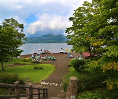Lakeshore view with dock and lawn seating at Asia Hotel FUJISAN, Yamanashi, Chūbu Japan