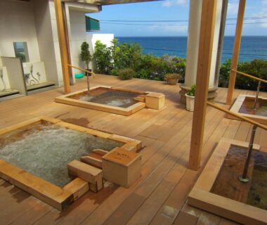 Wooden outdoor onsen baths on deck overlooking the sea at Atagawa Yamatokan, Shizuoka