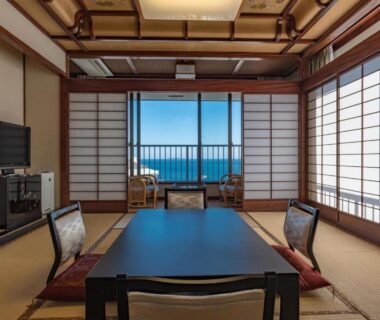 Tatami seating with low table and shoji screens overlooking ocean at Atami Onsen Sakuraya Ryokan Shizuoka
