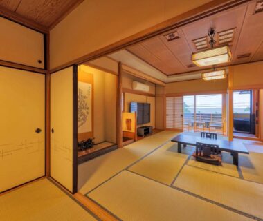 Japanese tatami room with low table and sliding doors at AtamiOnsen Nagahamaen, Shizuoka, Chūbu, Japan