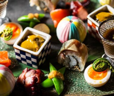 Colorful assortment of small traditional Japanese dishes served at Atarayo Nishiizu Onsen, Shizuoka