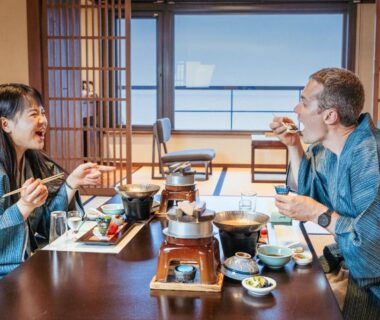 Couple in yukata dining at low table in tatami room with shoji screens at Awakan, Hyōgo, Kansai