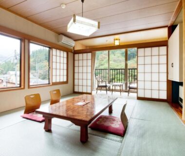 Bright tatami room with low table, shoji screens and balcony at Ayameya Ryokan, Gunma, Kantō