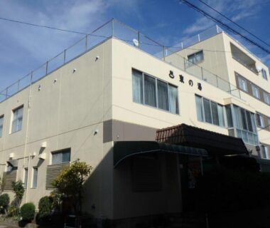 Three-story building exterior at Azuma no Yu in Nagano with entrance canopy and windows
