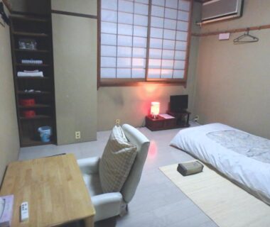 Tatami room with shoji screens and futons at Azuma no Yu in Nagano Chubu Japan
