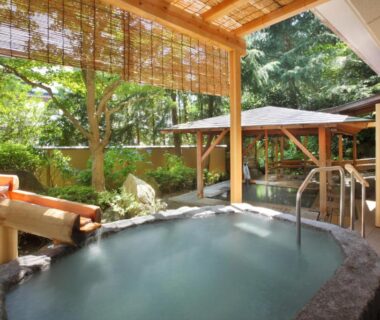 Stone outdoor bath with bamboo blinds at Azumakan in Fukushima, Tōhoku