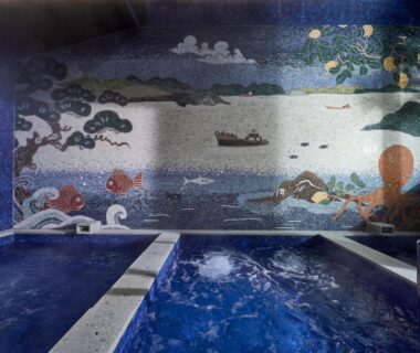 Indoor blue-tiled bath with seaside mosaic mural at Azumi Setoda, Hiroshima