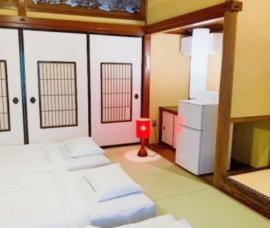 Tatami room with futons and shoji panels at B&B MIKAWA in Kanazawa, Ishikawa, Chūbu Japan