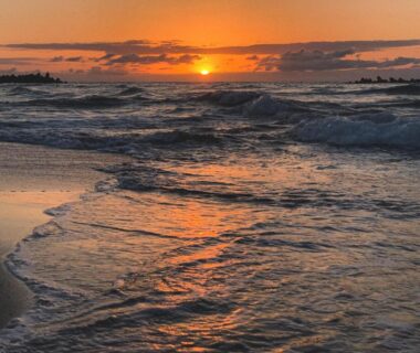 Sunset over waves along Kanazawa shoreline near B&B MIKAWA Fish Harbour, Ishikawa, Chūbu, Japan