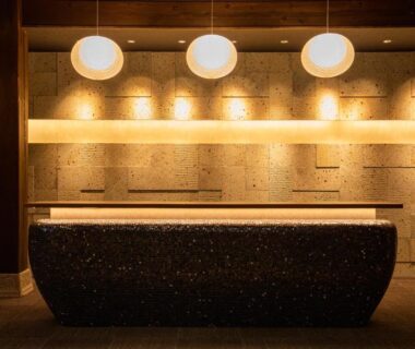 Indoor stone bath with pendant lights at Baien ryokan in Ōita, Kyūshū
