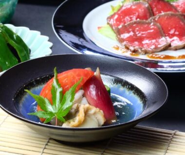 Assorted plated Japanese dishes with garnishes at Baigetsu Ryokan in Nagano, Chūbu Japan