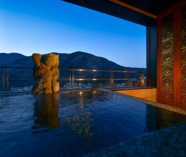 Outdoor onsen bath with mountain view at Balinese onsen ryokan Hakone Airu, Kanagawa