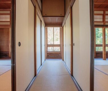 Tatami corridor with shoji screens and garden view at Bansuirou Fukuzumi in Kanagawa