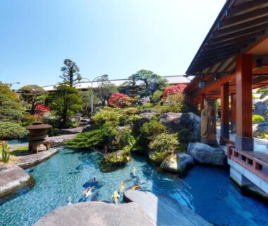 Manicured garden pond with koi and wooden veranda at Beautiful Japanese Garden Kagetsu in Yamanashi, Chūbu