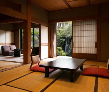 Traditional tatami room with low table, cushions, shoji screens and garden view at Beautiful Japanese Garden Kagetsu, Yamanashi