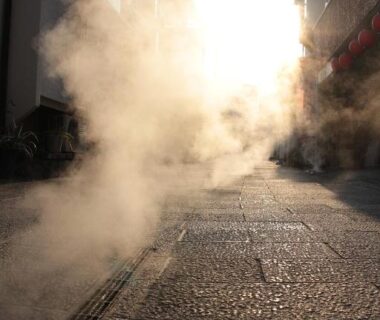 Steam rising from a stone-paved street near Beppu Kannawa Onsen HIROMIYA in Ōita, Kyūshū, Japan
