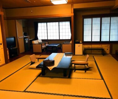 Traditional tatami room with low table and shoji screens at Beppu Kannawa Oniyama Hotel, Ōita