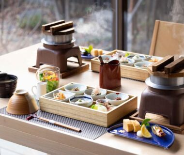 Traditional tabletop dining with multiple small dishes at Beppu Nagomitsuki in Ōita, Kyūshū, Japan