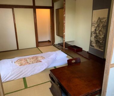 Traditional tatami room with futon bedding, low wooden table, sliding fusuma doors at Beppu no Oyado Kagaya in Ōita
