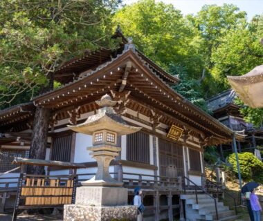 Wooden shrine with stone lanterns at Bessho Onsen Midoriya, Nagano, Chūbu, Japan
