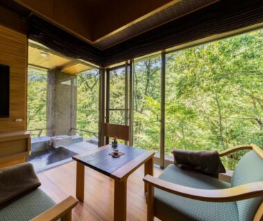 Wooden soaking tub, low table and chairs with forest view at Bettei Senjyuan, Gunma