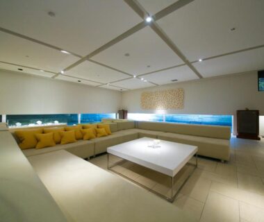 Modern spacious lounge with low table and wraparound sofa at Bourou NOGUCHI Noboribetsu, Hokkaidō