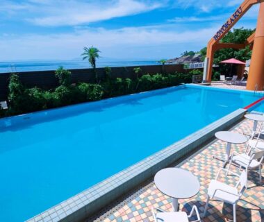 Outdoor pool with lounge chairs at Boyokaku in Okinawa, Japan