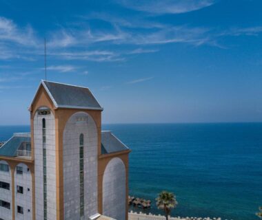 Seafront tower facade with arched windows, Boyokaku ryokan on Kumamoto coast, Kyushu