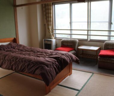 Tatami flooring with western bed and window seating at Cafe Cerisier栖里時絵 in Niigata, Chūbu Japan