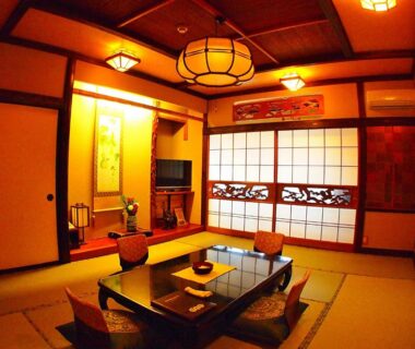 Tatami room with low table, zabuton cushions and shoji screens at Central Hotel 中央ホテル in Nagano, Chūbu