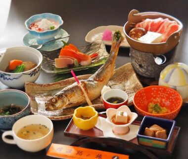 Assorted Japanese meal with grilled fish, hot pot and small dishes at Central Hotel Nagano