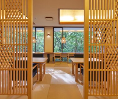 Tatami dining area with wooden lattice screens and tables overlooking greenery at Centurion Hakone Bettei, Kanagawa, Japan