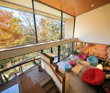 Multi-level lounge with floor-to-ceiling windows and colorful seating at Centurion Hakone Bettei, Kanagawa